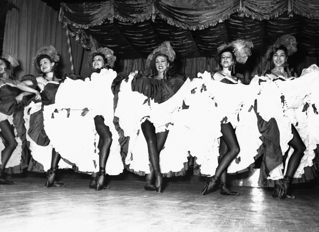#67 Star dancers from the Paris Opera dance the French Cancan at the Moulin Rouge, 1953