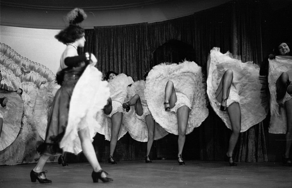 #72 A troupe of can-can dancers leave little to the imagination during a performance of ‘The Blue Bird’, 1953