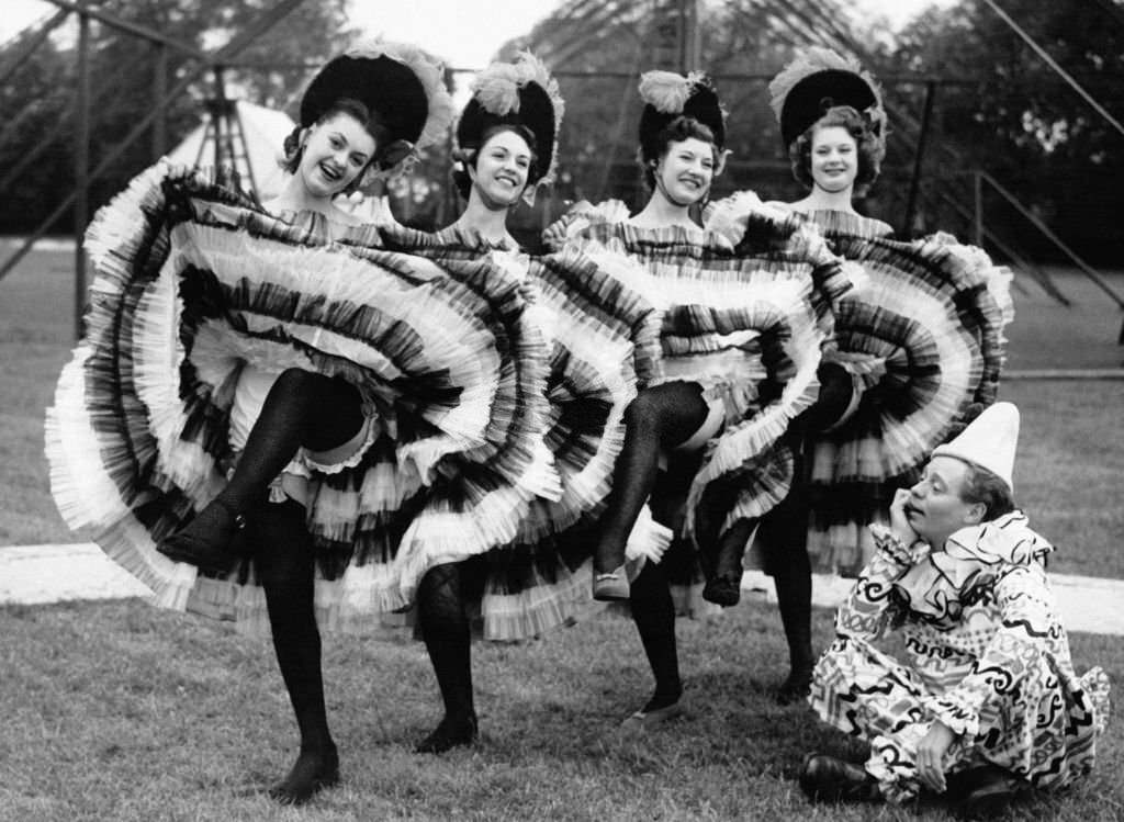 #6 Jimmy Handley watches French cancan dancers rehearsing for the Roehampton Theater and Film Festival, 1950