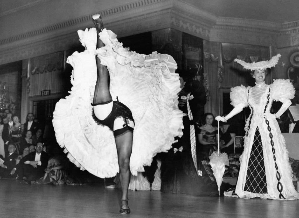 #8 A dancer performs a cancan during the National Advertising Benevolent Fund Ball at the Dorchester Hotel on May 3, 1949