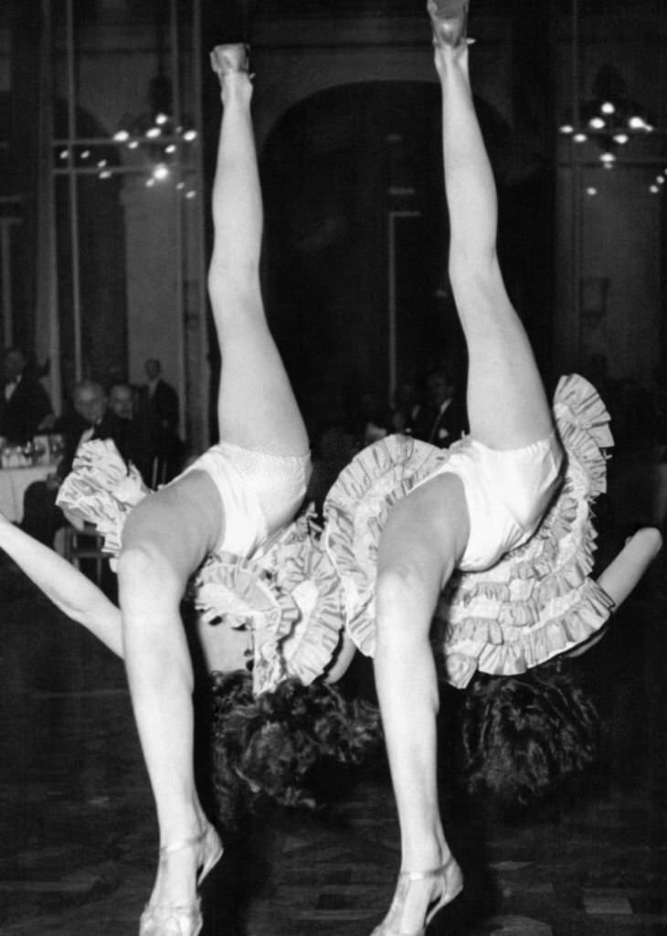 #101 Two cancan dancers are the attraction of a dinner offered by the Anglo-American press at the Claridge Hotel, 1906