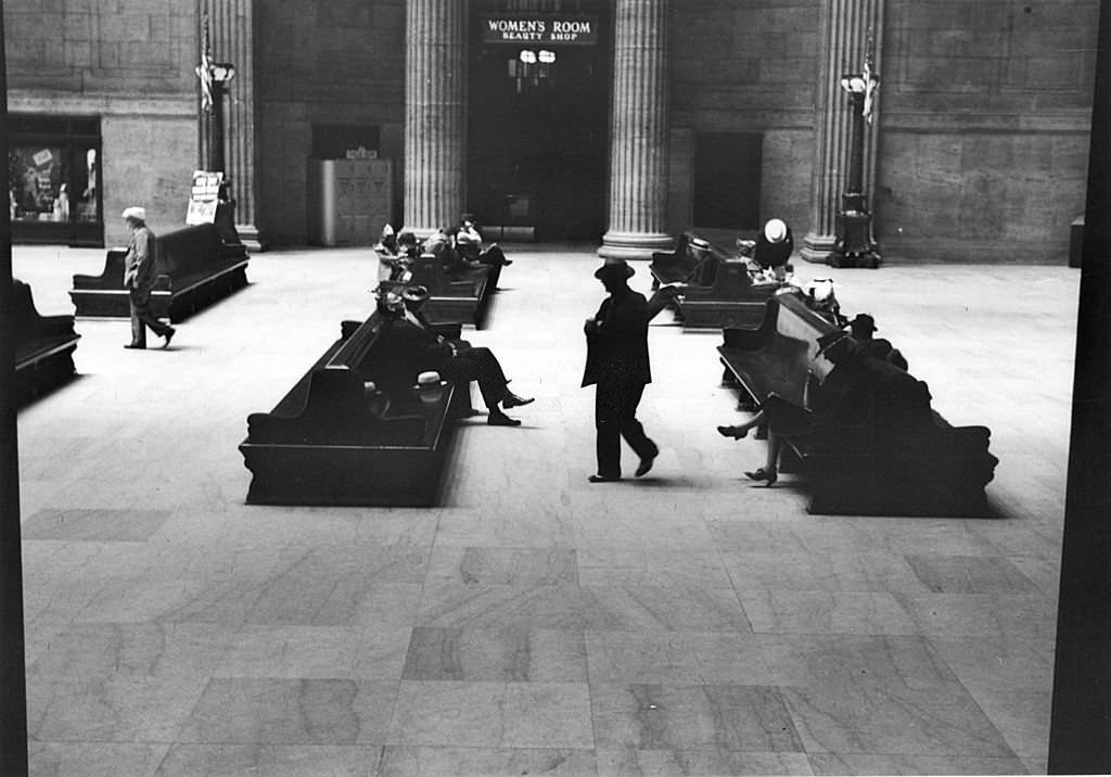 #5 Passengers wait at the nearly deserted railway terminal at Union Station, Chicago, Illinois, July 1941.