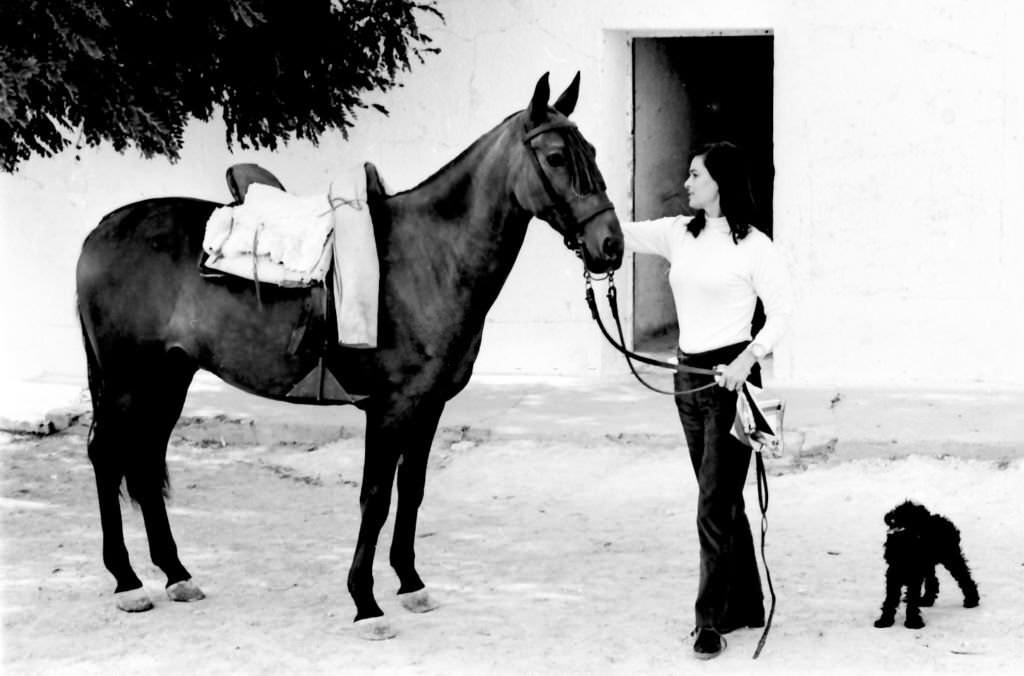 #10 Italian actress Lucia Bose with her horse on her farm of Villa Paz, Saelices, Cuenca, Spain, 1967.