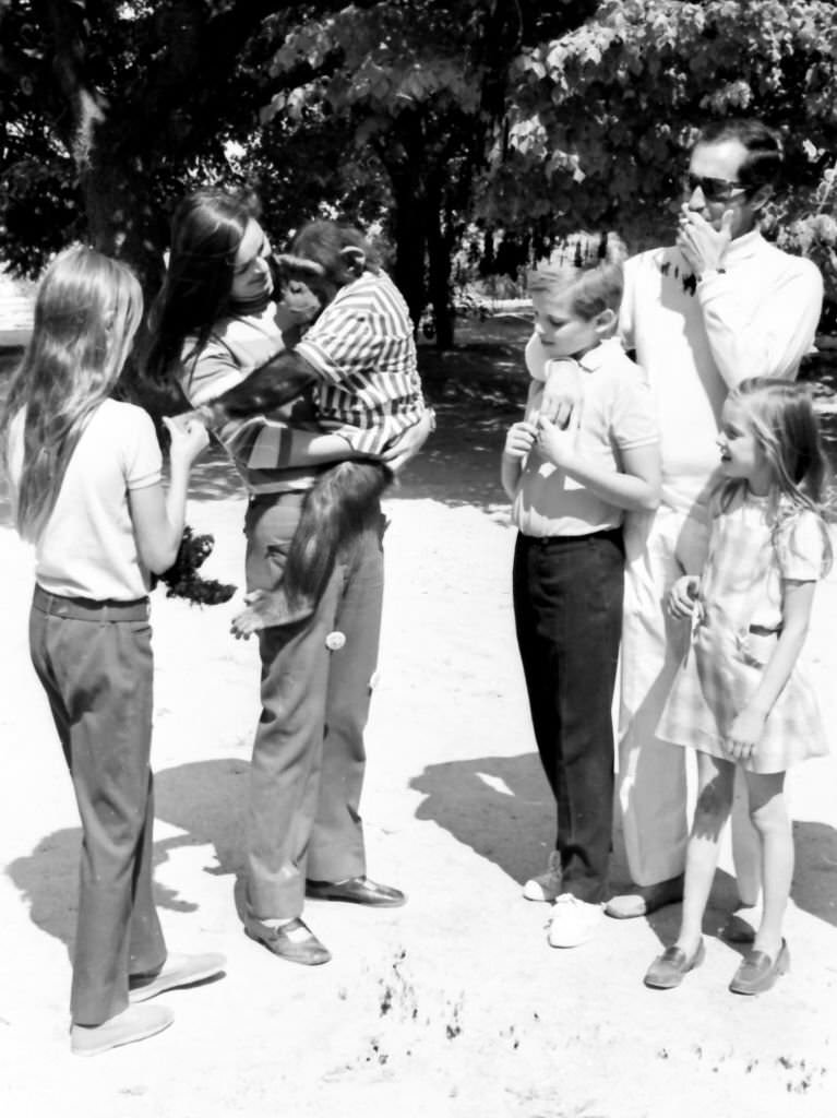 #3 Spanish bullfighter Luis Miguel Dominguin and his wife the Italian actress Lucia Bose play with a monkey together with their children Miguel, Lucia a Paola at their Villa Paz farm, Saelices, Cuenca, 1967.