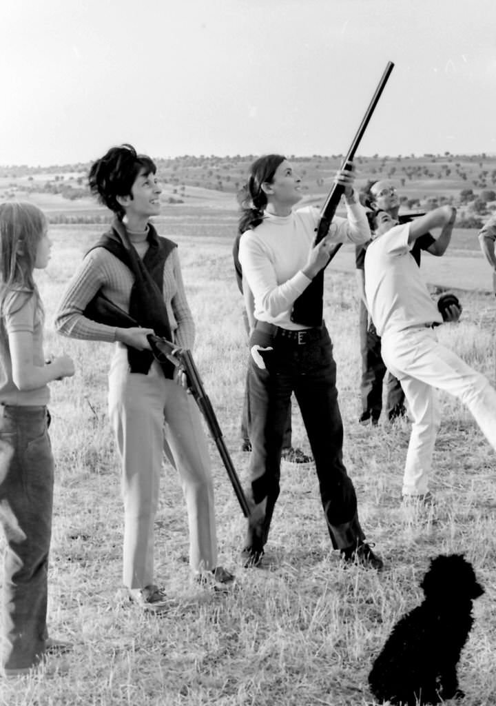 #8 Lucia Bose practices skeet shooting at her farm in Villa Paz, Saelices, Cuenca, Spain, 1967.