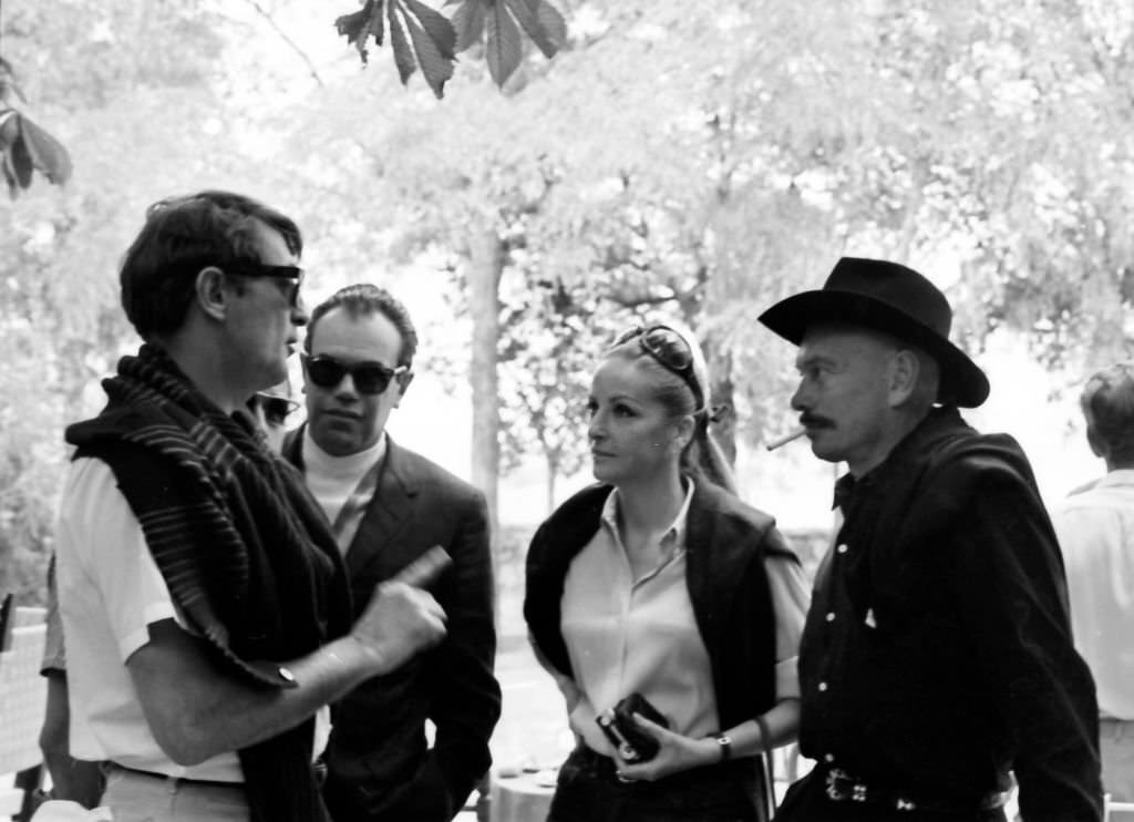 American actors Robert Mitchum with Yul Brynner and his wife Doris Kleiner at the “Villa Paz” farm of the bullfighter Luis Miguel Dominguin Saelices, Cuenca, Spain, 1967.