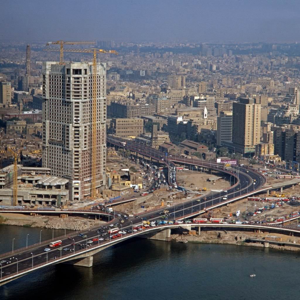 #106 Ramses Hilton Hotel under construction and “6 October” bridge at Cairo, Egypt, late 1970s.