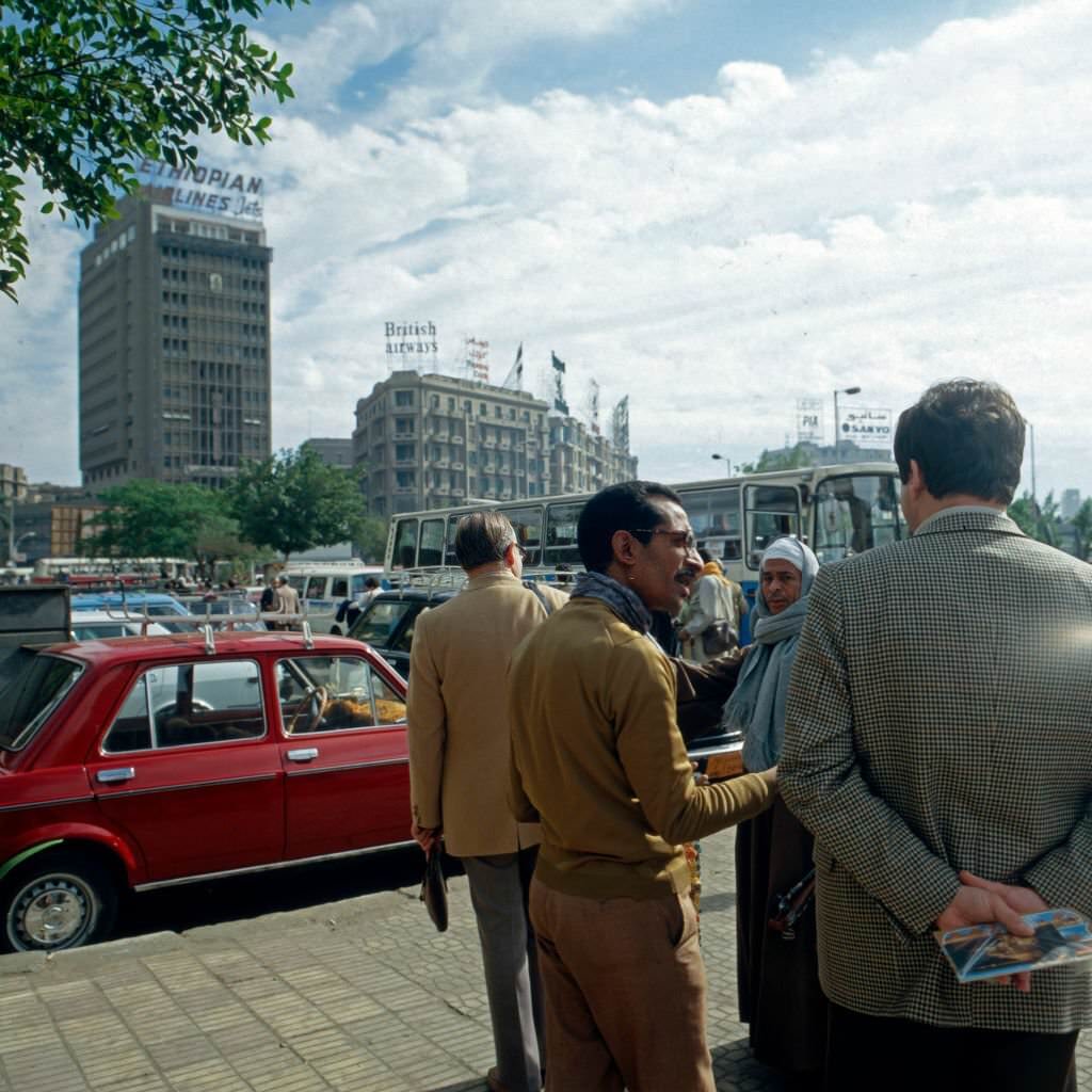 #113 Cairenes discussing on the streets near Midan al Tahrir square at Cairo, Egypt, late 1970s.