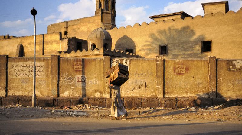 #202 Cairo back street with porter and mosque, Egypt