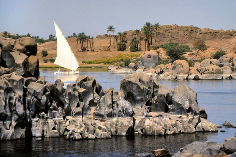 #209 Felucca sailboat amid weathered rocks, Aswan, Egypt