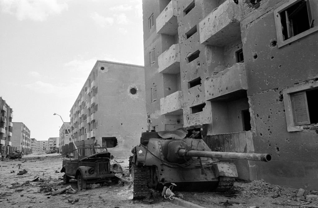 #30 Destroyed Egyptian military vehicles in a deserted Suez street, 1973
