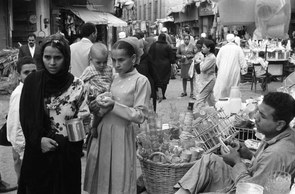 #44 Two young women without veils shopping in a bazaar in Cairo, 1972