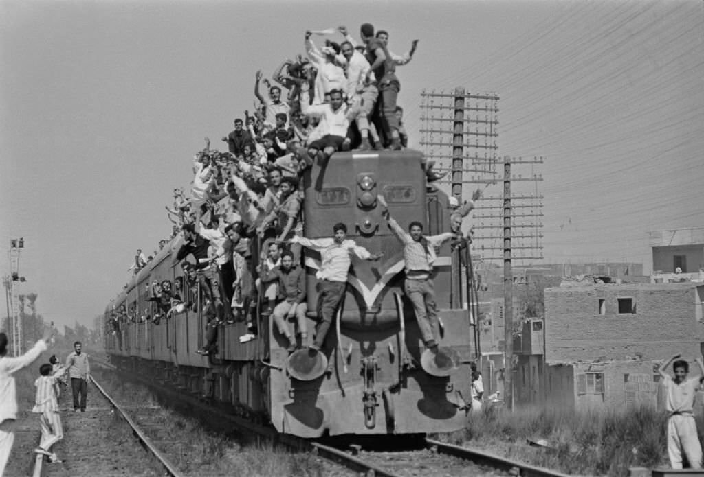 #60 Egyptians overcrowd a train during President Gamal Abdel Nasser’s funeral, Cairo, 28th September 1970.
