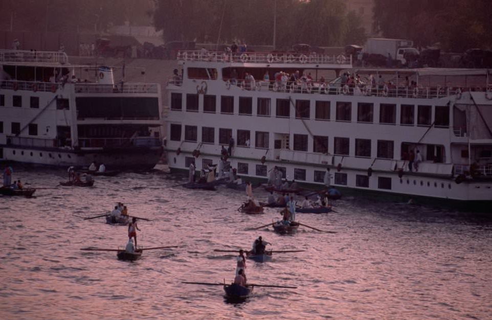 #85 Local vendors at Esna pull up alongside the large hotel-boats that cruise the Nile, to sell galabiyas and other local trinkets.