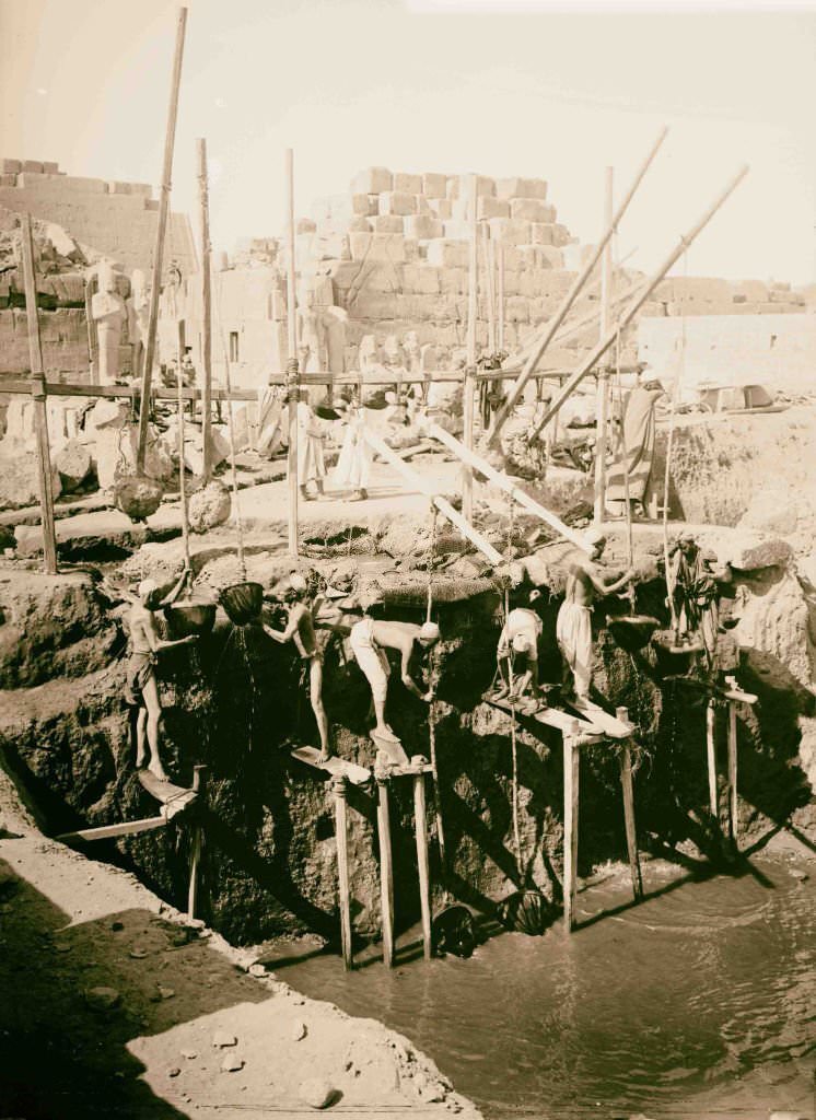 #150 Taking out water from excavations, Karnak, Egypt, 1900.