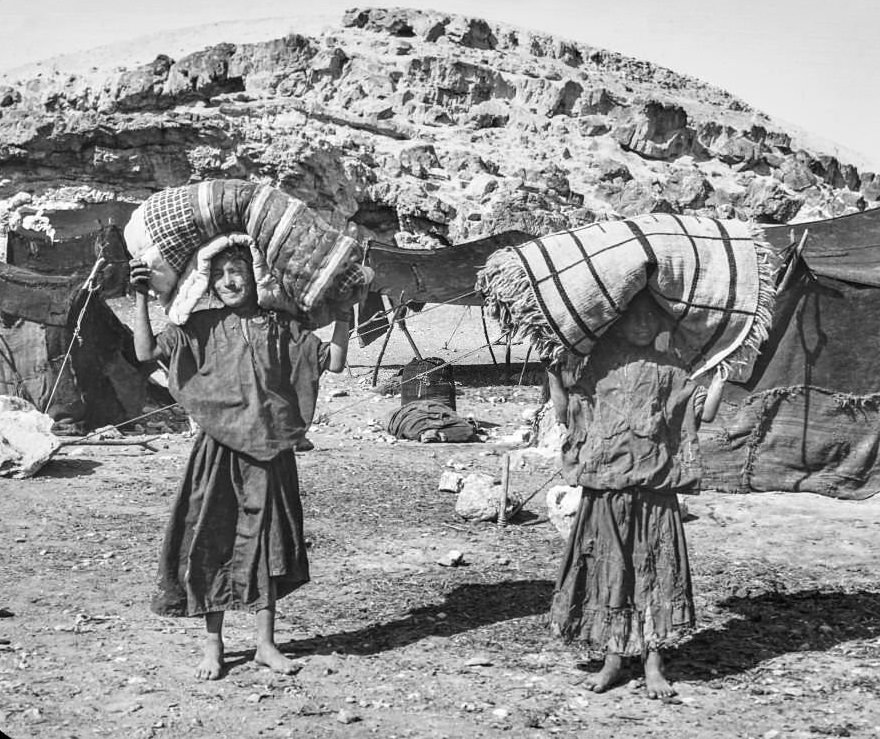 #91 An expidition in Cairo boys carrying their beds from base camp, 1900