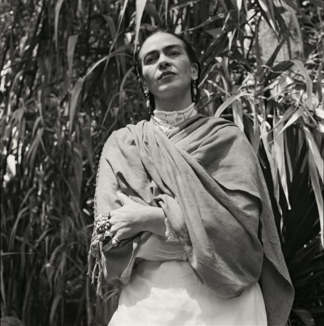 #24 Frida Kahlo in her garden, 1951.