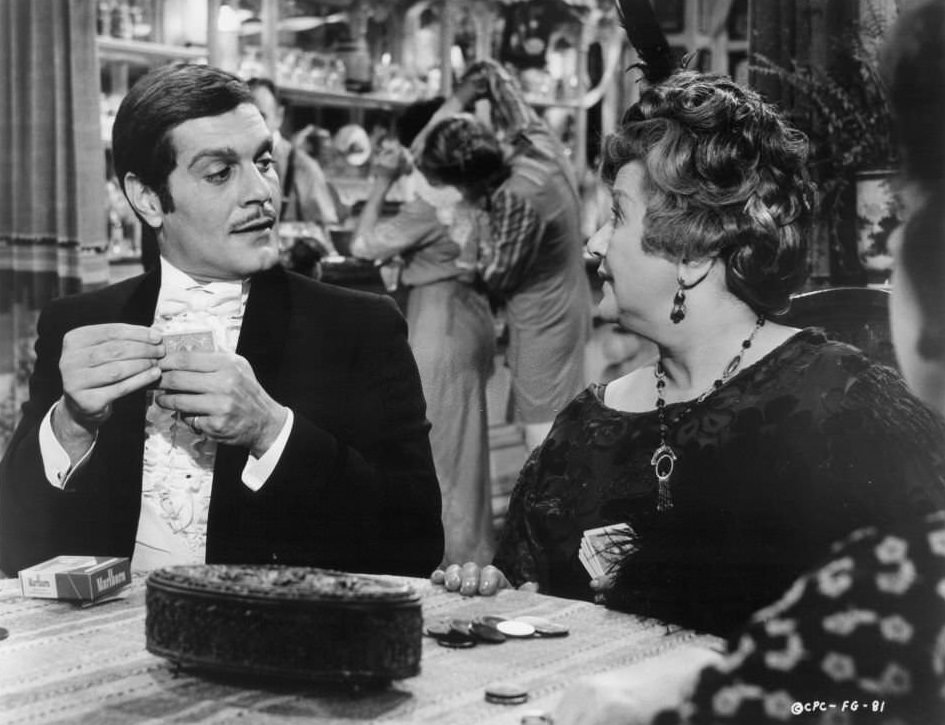 Omar Sharif at card table in a scene from the film ‘Funny Girl’, 1968.