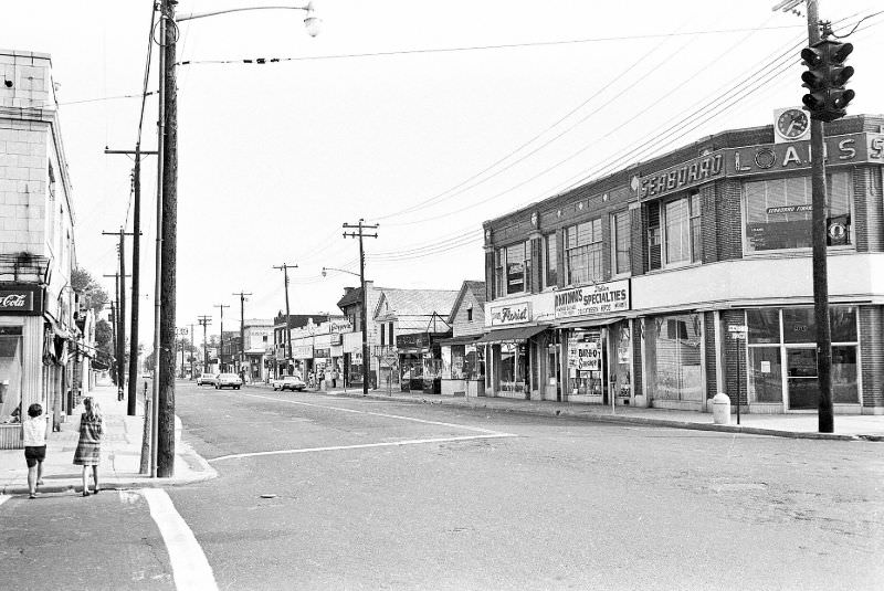 #17 Broadway looking south from Marie St. Henry Huettner’s Dept. store, built in 1918, is on the right corner, Hicksville, New York, 1966