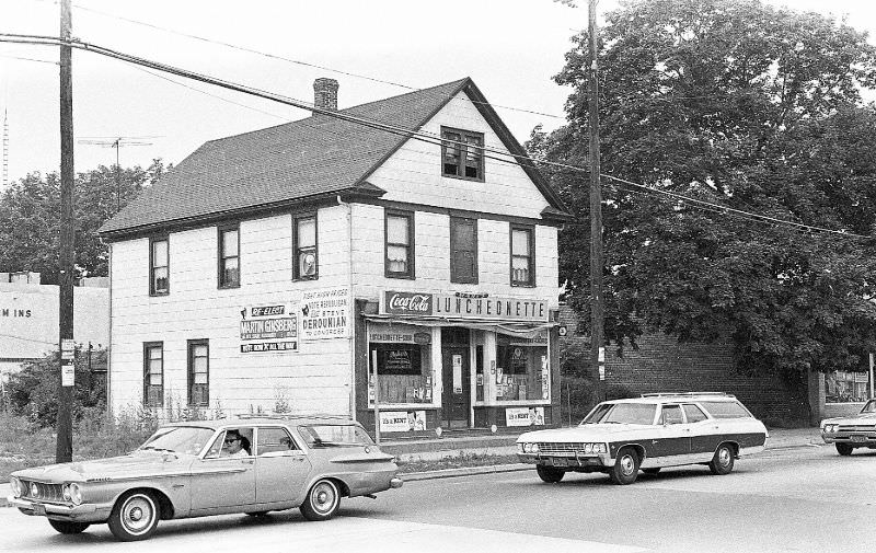 Mary’s Luncheonette in center, a private house( recessed to the right ) and the left side of the old Goldman Bros. Store to the right, Hicksville, New York, 1967