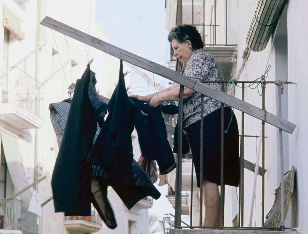 #38 Woman tending clothes in Ibiza, 1976