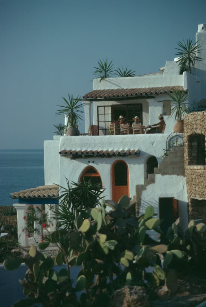 #6 Residents on the balcony of a villa on the bay of Cala Xarraca, near Portinatx, Ibiza, Spain, 1978.