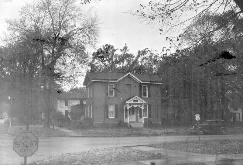 #23 Victorian house. Road sign is for US 59 and K-10. Somewhere on 6th Street, Lawrence, Kansas, November 1947