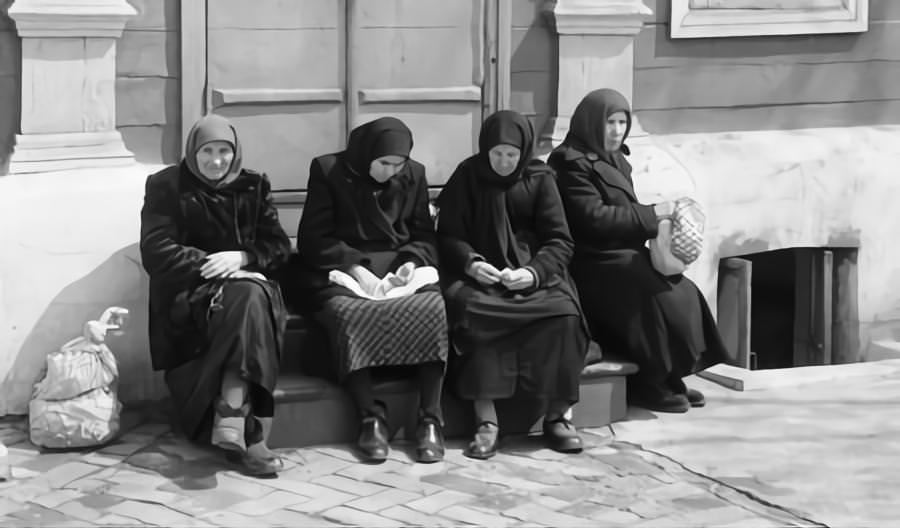 #38 Female residents of the Soviet city of Kyiv, sitting together on the steps of a building in one of the city streets May 1960