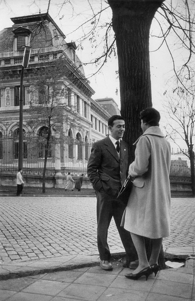 #3 A man and a woman chatting beside a tree. Madrid, May 1960