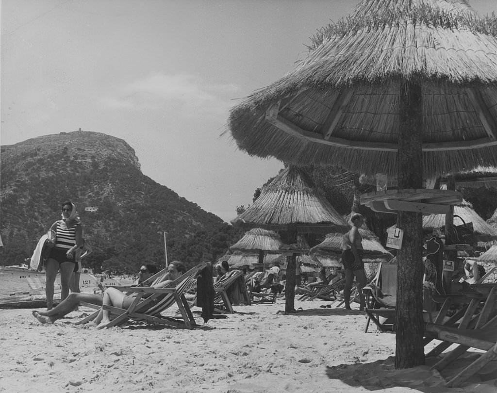#109 Straw beach umbrellas at Formentor beach in Majorca, Balearic Islands, 1955