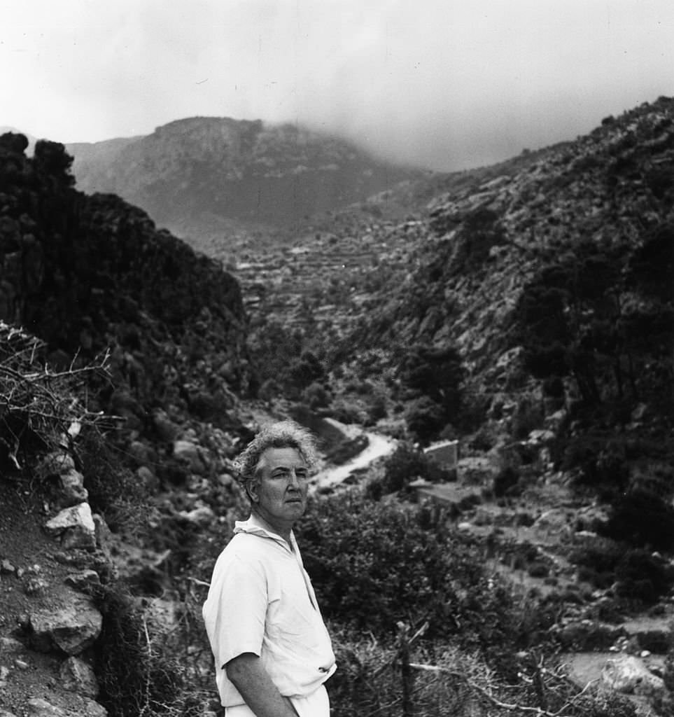 #112 Robert Ranke Graves surveys the hilly landscape of his home island of Majorca, 1954