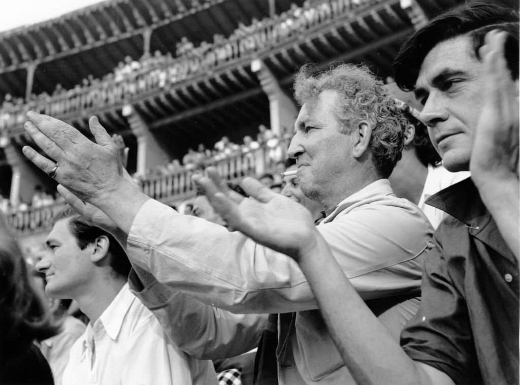 #115 Robert von Ranke Graves applauds a bullfighter at the ring in Palma de Majorca.