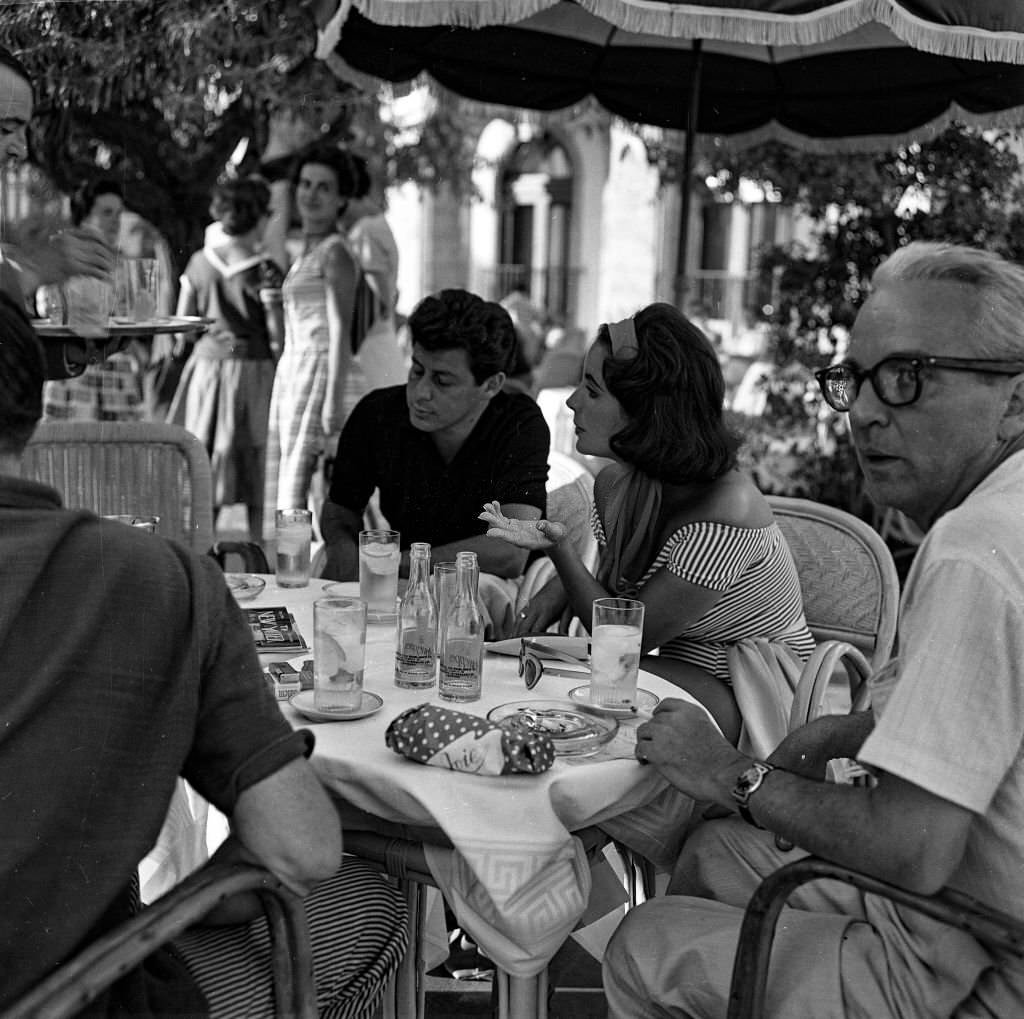 #79 British actress, Elizabeth Taylor and her current husband, Eddie Fisher (L) enjoy a holiday in Mallorca, 1959