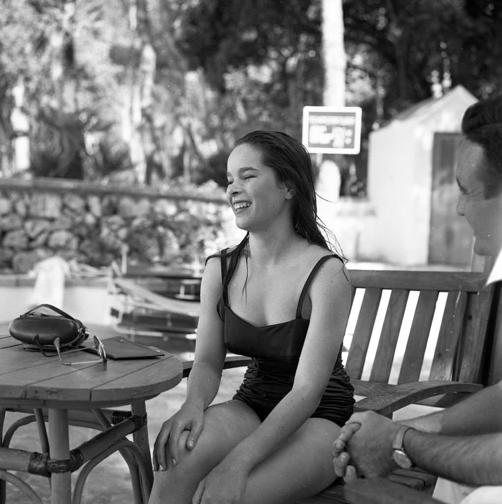 #82 Oona O’Neill, wife of Charles Chaplin during a family holiday in Mallorca, 1959
