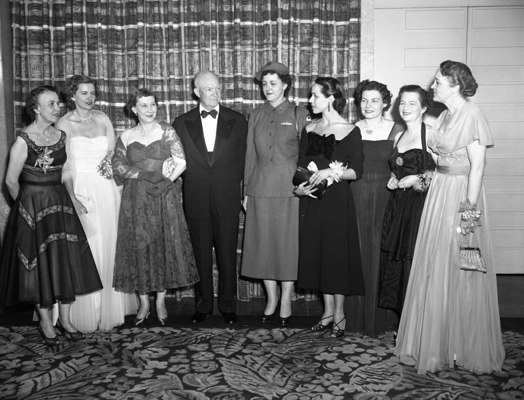 #79 President Dwight Eisenhower talks with the winners of the women of achievement awards at the Annual Dinner of the Women’s National press Club in Washington last night.