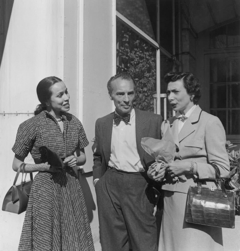#17 Maria Tallchief and Nora Kaye with American ballet choreographer George Balanchine in Paris, 1950