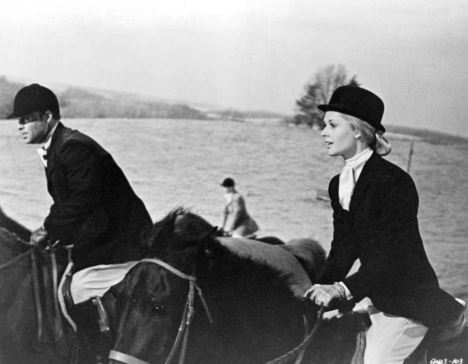 #21 Sean Connery questions Tippi Hedren about her abnormal fear of the lightning storm flashes that penetrate the room in film ‘Marnie’, 1964.