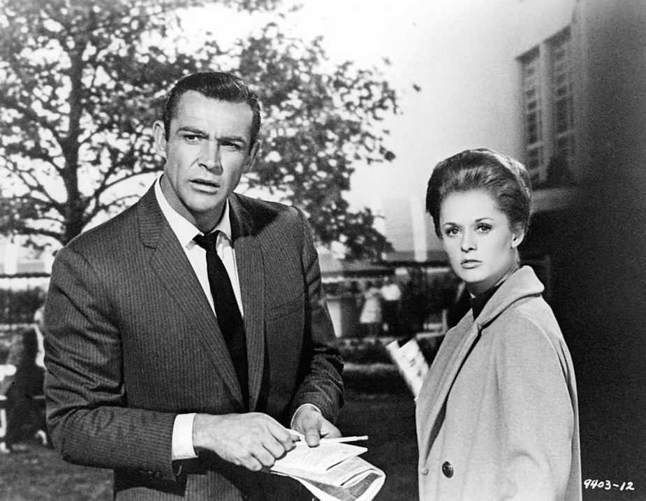 Tippi Hedren is handed documents from Sean Connery in a scene from the film ‘Marnie’, 1964.