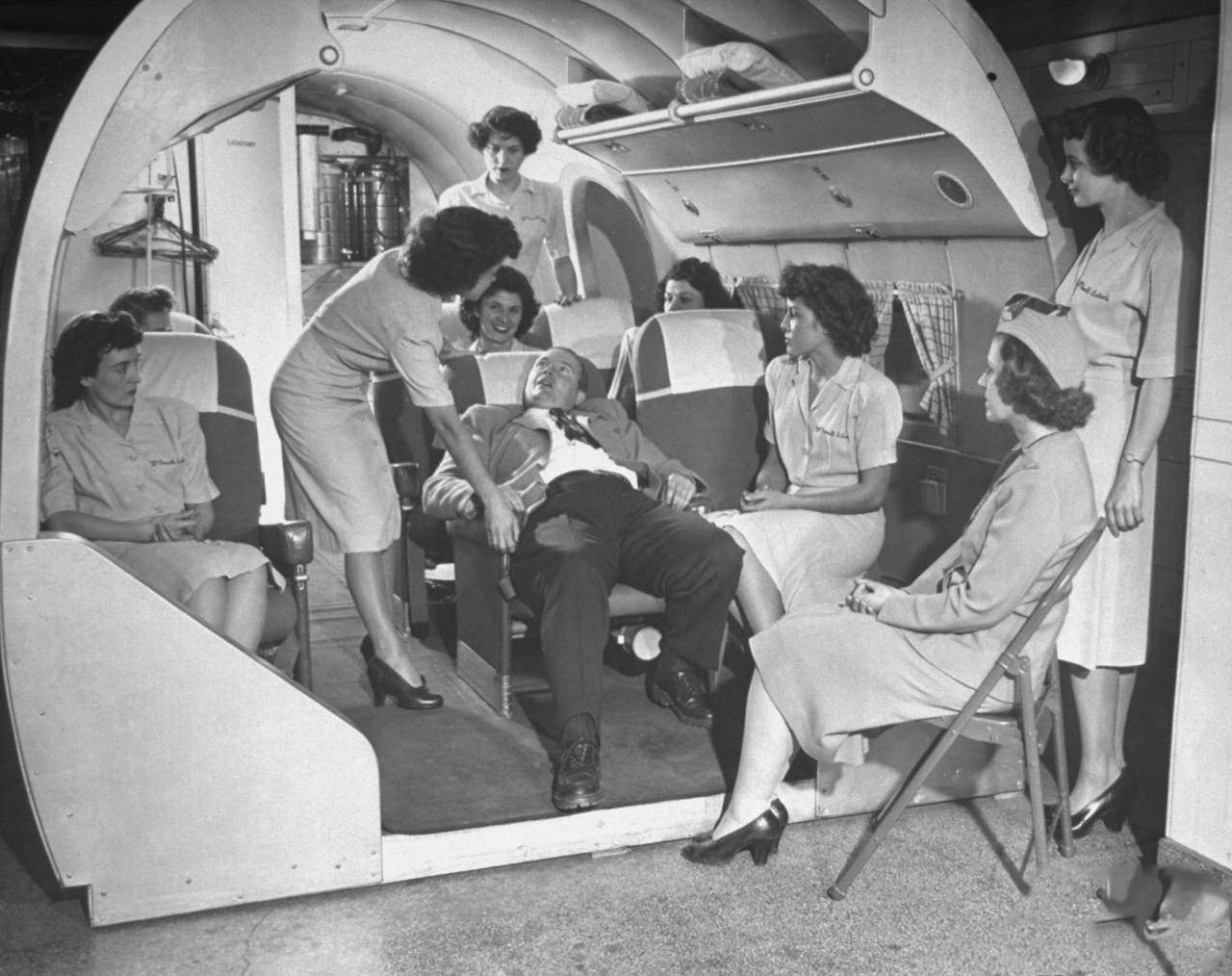 #4 Students at the McConnell Air Hostess School learning how to deal with inebriated passengers.