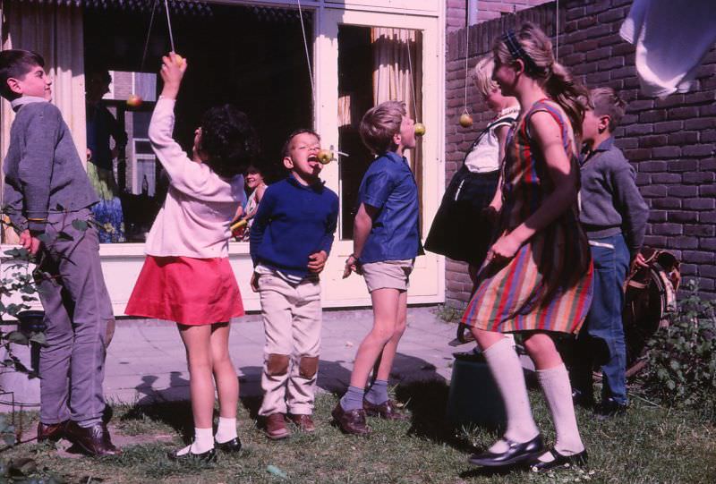 #41 Kids play bobbing for apples, Woerden, Netherlands, 1966