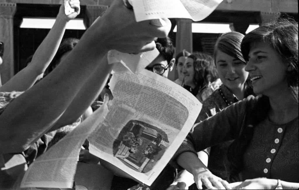 #14 On the Atlantic City Boardwalk, demonstrators, among them Helen Kritzler (right), tear up magazines as they protest the Miss America beauty pageant, Atlantic City, New Jersey, September 7, 1968.