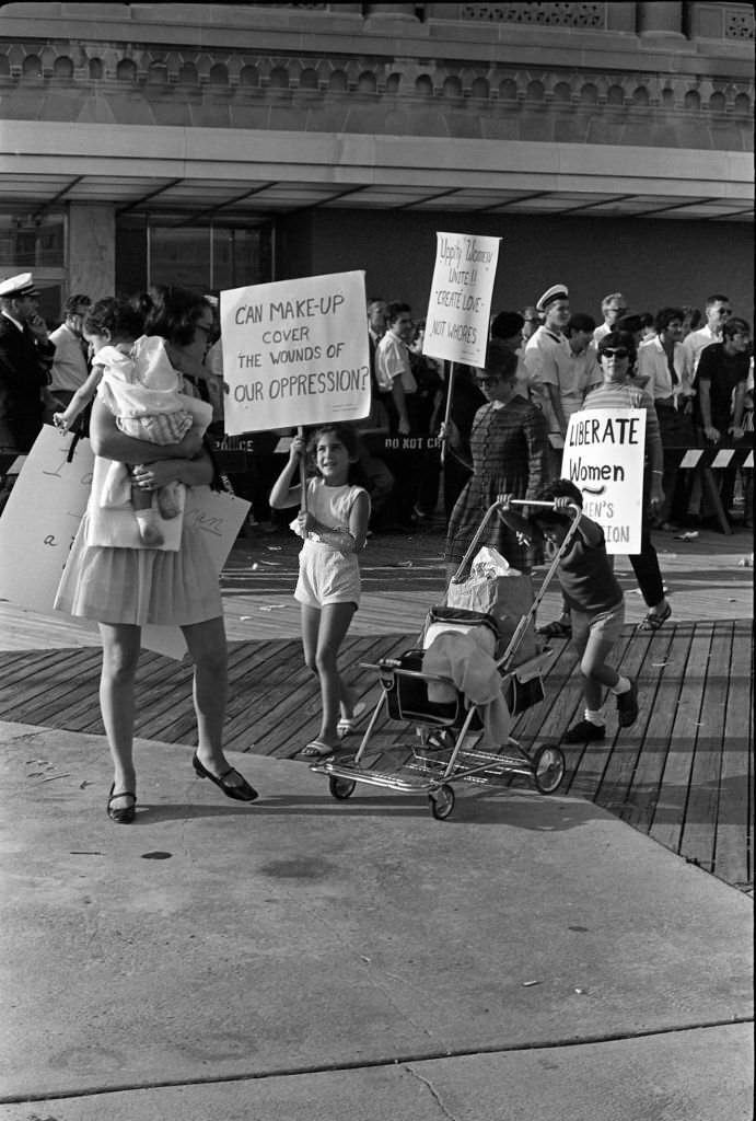 #25 Demonstrators carry posters as they protest the Miss America beauty pageant, Atlantic City, New Jersey, September 7, 1968.