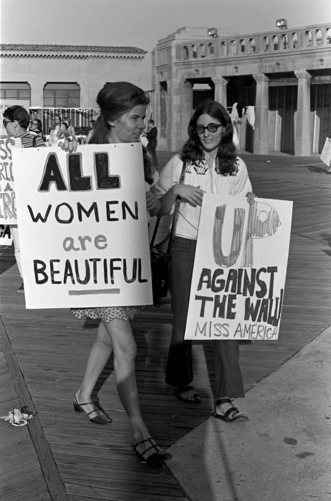 #32 Demonstrators carry posters as they protest the Miss America beauty pageant, Atlantic City, 1968.