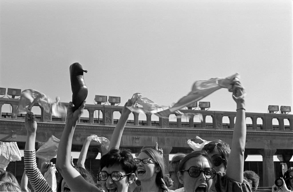 #11 On the Atlantic City Boardwalk, demonstrators, some waving high heels or underwear, protest the Miss America beauty pageant, Atlantic City, New Jersey, September 7, 1968.