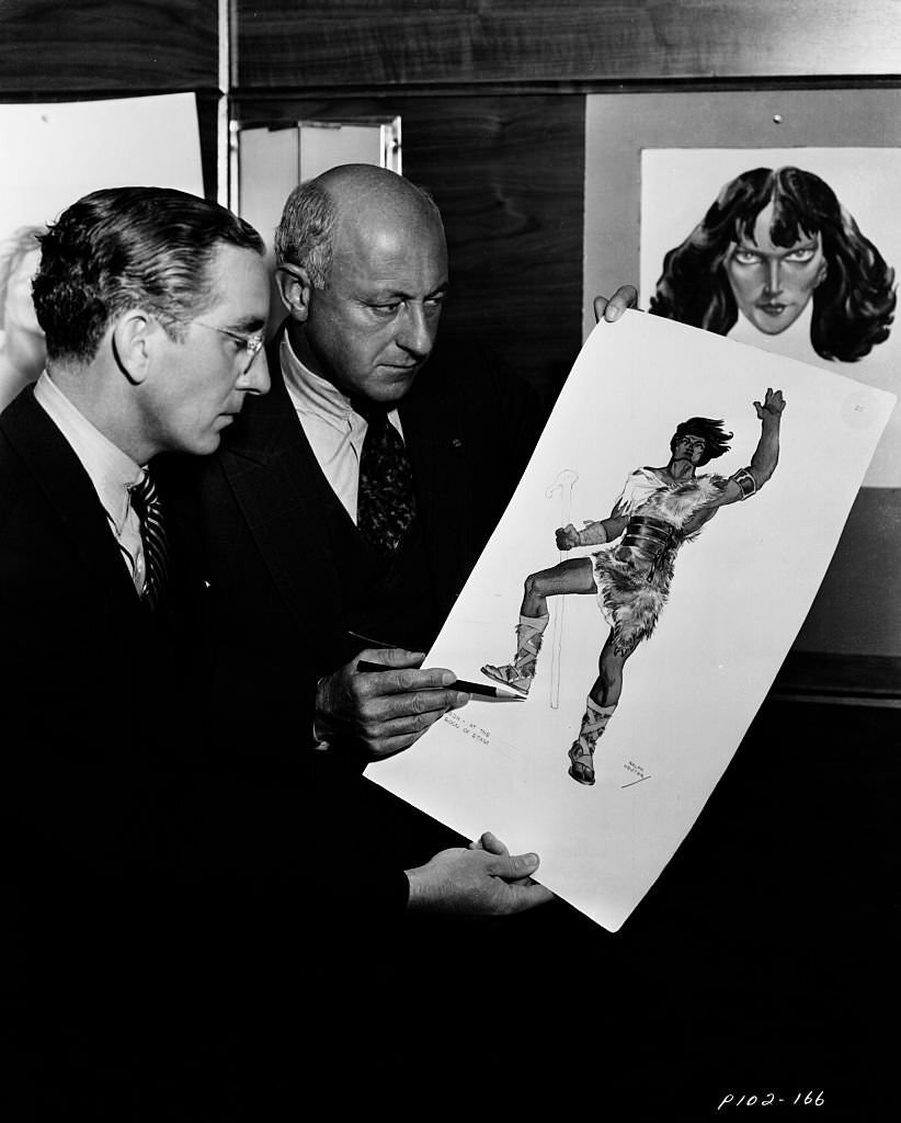 Filmmaker Cecil B DeMille inspecting costume design ideas for the film ‘Samson and Delilah’