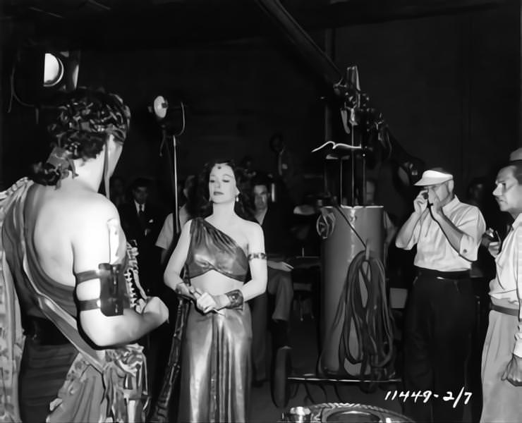 Victor Mature and Hedy Lamarr, Cecil B DeMille and Cinematographer George Barnes on set candid during filming of ‘Samson and Delilah’, 1949