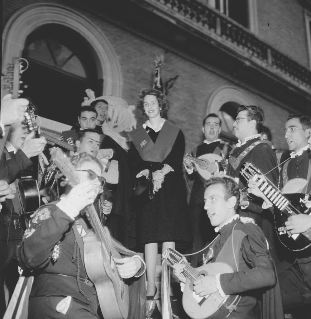 #15 Queen Fabiola of Belgium with a student tuna during her visit to Seville on the occasion of Holy Week, 1965