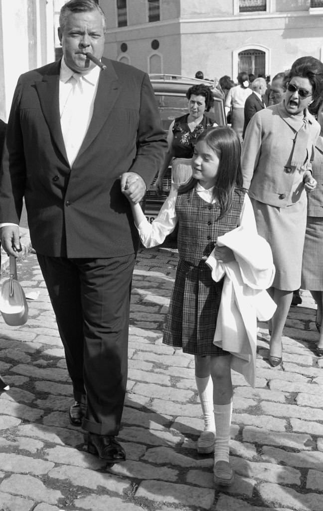 #18 American actor and director Orson Welles in the “Feria de Sevilla” with his daughter Beatrice, Sevilla, Spain, 1966.