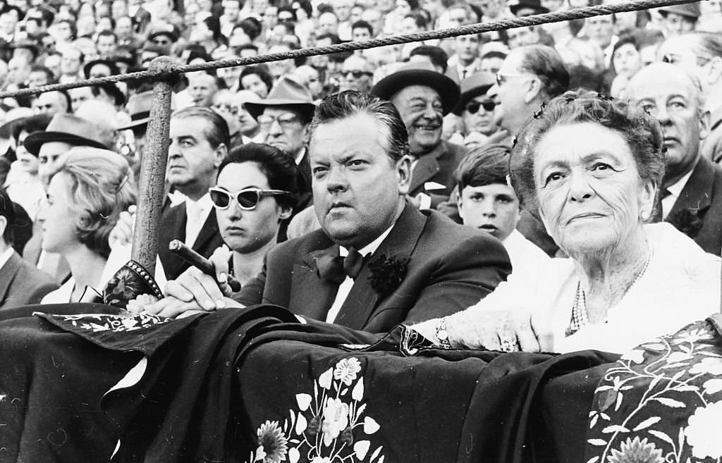 #25 Actor and director Orson Welles sitting on the front row watching the traditional Spring Festival in Seville, April 24th 1961.
