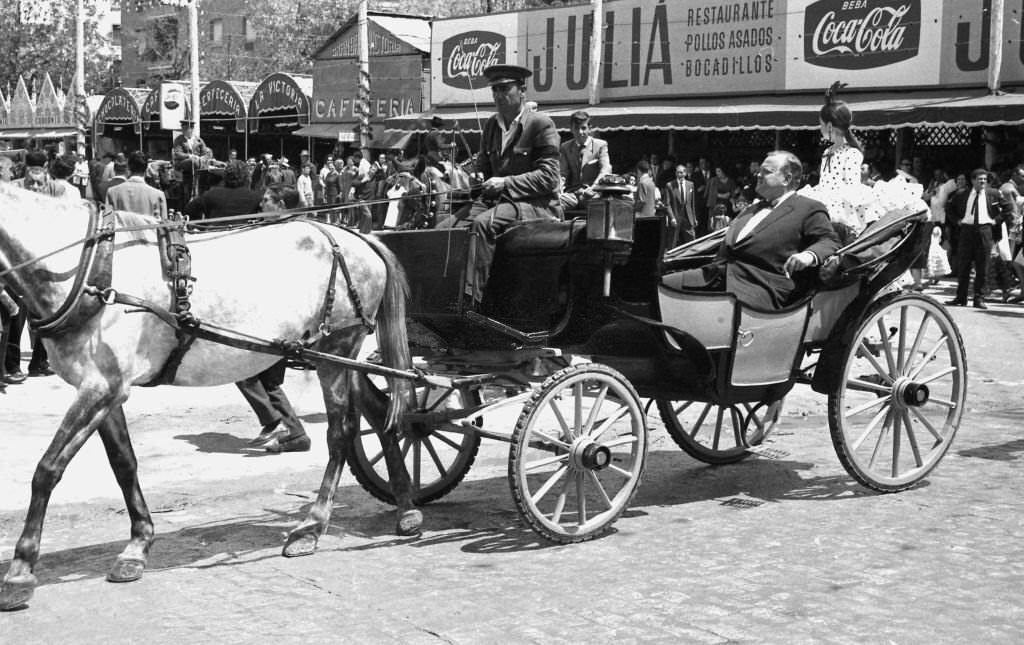 #7 American actor and director Orson Welles in the “Feria de Sevilla” with his daughter Beatrice, Sevilla, Spain, 1966.